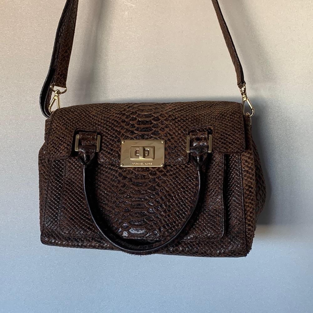 Michael Kors suede snake print to a brown handbag